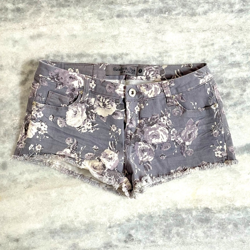 Floral print Jean shorts with raw edge. Size 7.